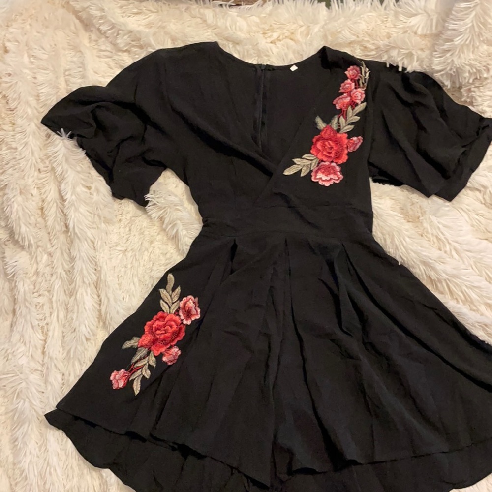 Black Romper with Floral Detail.